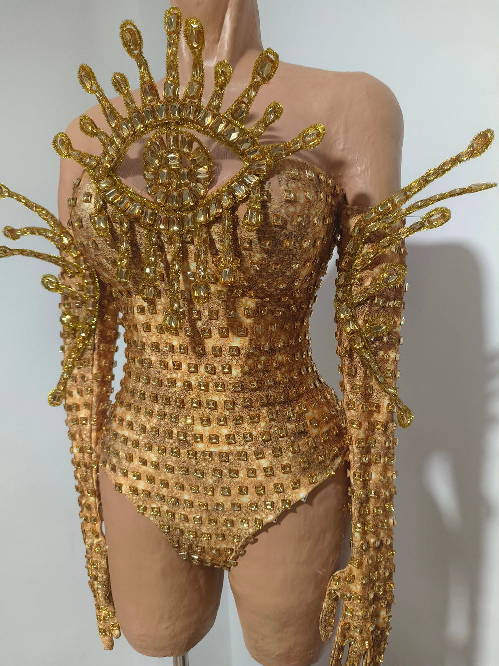 Golden eye embellished bodysuit on mannequin