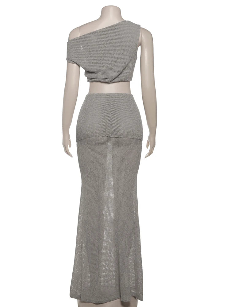 Mannequin wearing a gray two-piece outfit on a white background