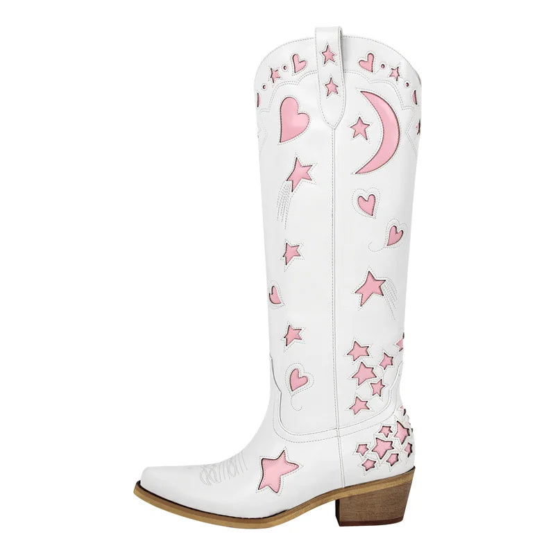 White knee-high boot with pink star and moon embroidery, showcasing a pointed toe and block heel.