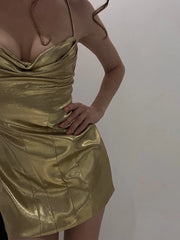 Close-up of metallic cowl neck mini dress fabric