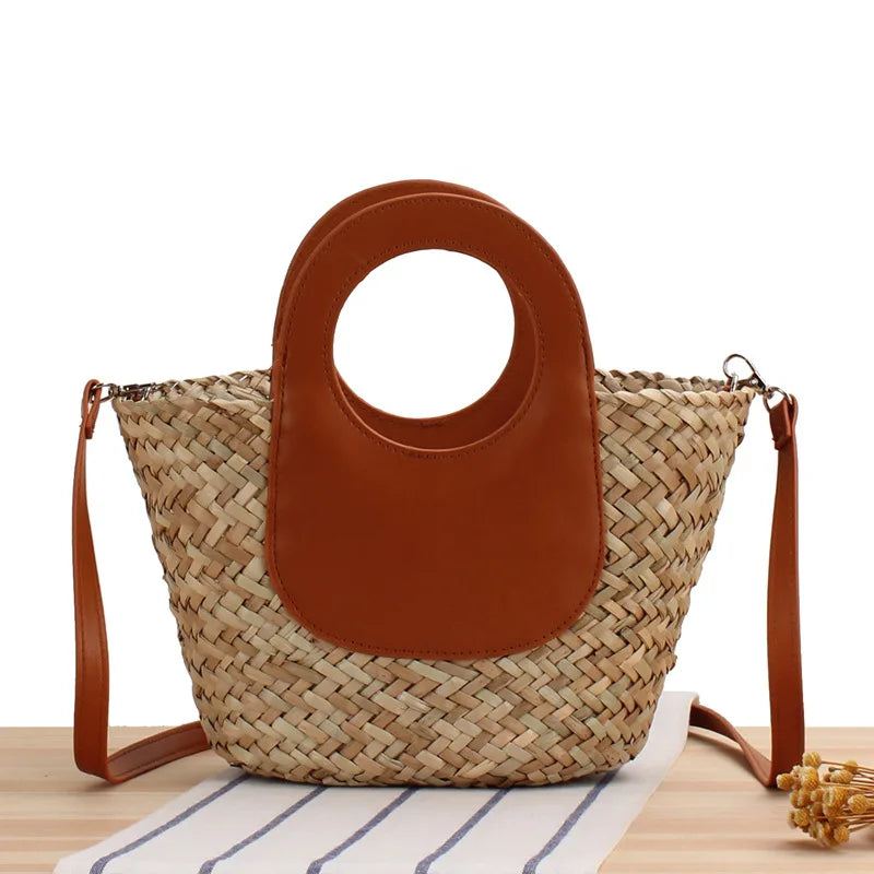 Woven bag with brown leather top section on a white background