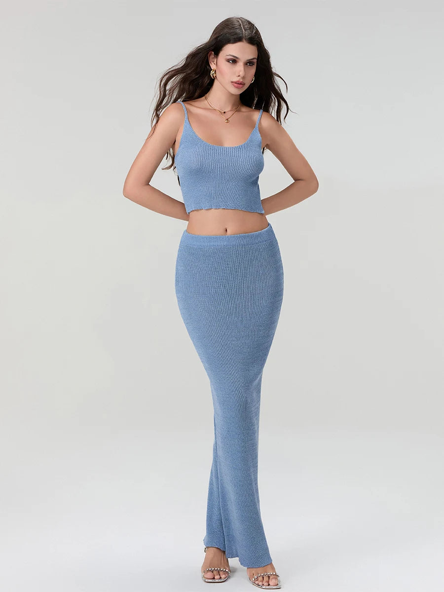 Woman wearing a blue ribbed crop top and high-waisted pants