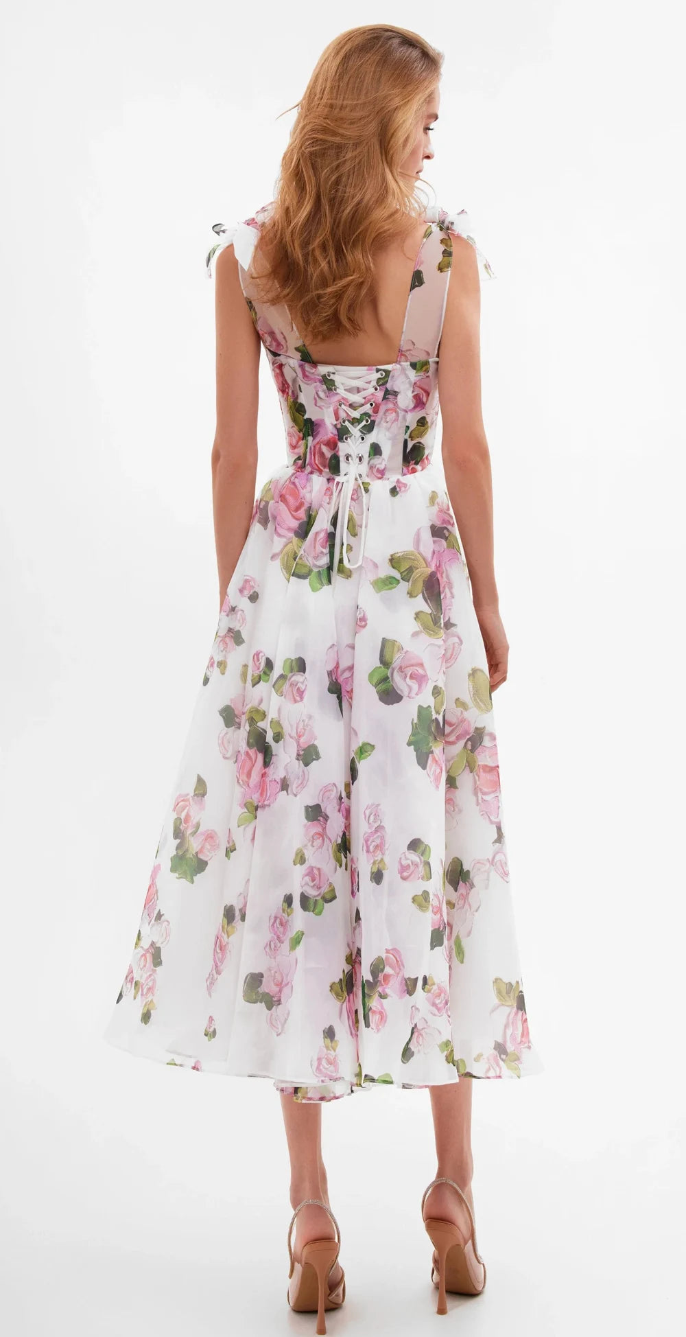 Back view of a floral print off-shoulder midi dress with lace-up detail.