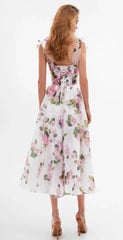Back view of a floral print off-shoulder midi dress with lace-up detail.