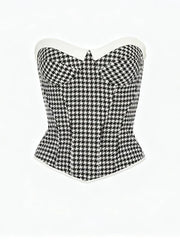 Black and white houndstooth patterned corset on a white background