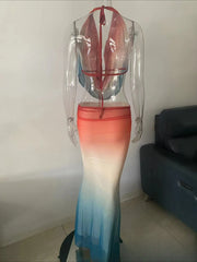 Gradient dress on a mannequin against a plain wall.