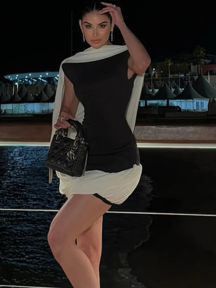 Sculpted mini dress with flowing asymmetric cape detail