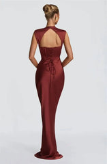 Back view of black satin cowl neck mermaid maxi dress with lace-up detail
