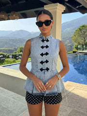 Denim peplum top styled with shorts
