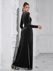 Woman wearing a black velvet dress in an elegant interior setting