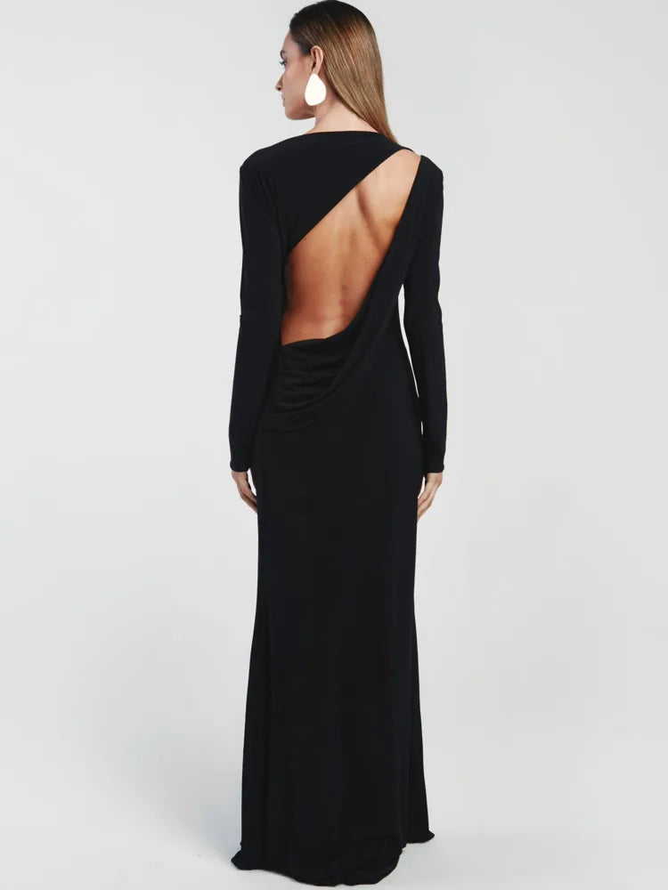 Black evening gown with open back on a white background