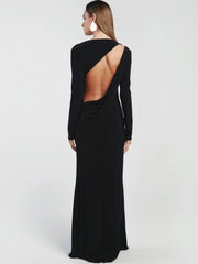 Black evening gown with open back on a white background