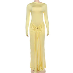 Yellow evening gown with long sleeves on a white background