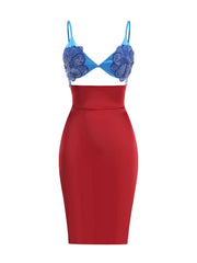 Red dress with blue floral embellishments on a white background