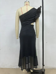 Black one-shoulder dress on a mannequin against a plain background