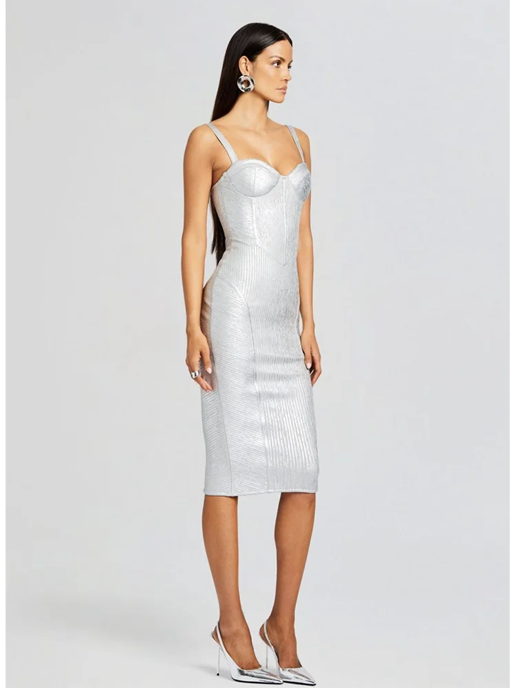 Woman wearing a silver sequin dress on a white background
