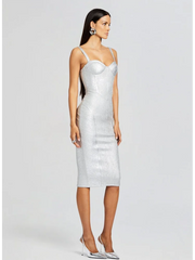 Woman wearing a silver sequin dress on a white background