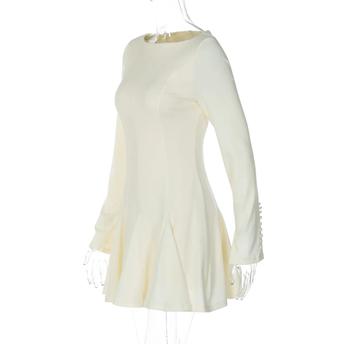 White dress with fringe details on a white background