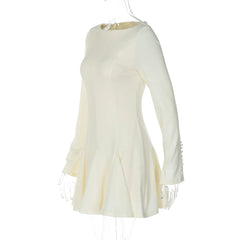 White dress with fringe details on a white background