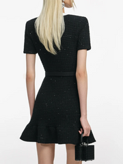 Embroidered knit dress styled with an empire waist