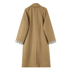 Back view of a reversible coat showing the solid side with a slit.