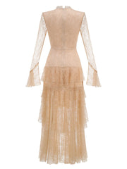 Back view of an apricot colored long sleeve lace maxi dress with V-neck and ruffle skirt