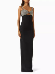 Black evening gown with silver embellishments on a white background