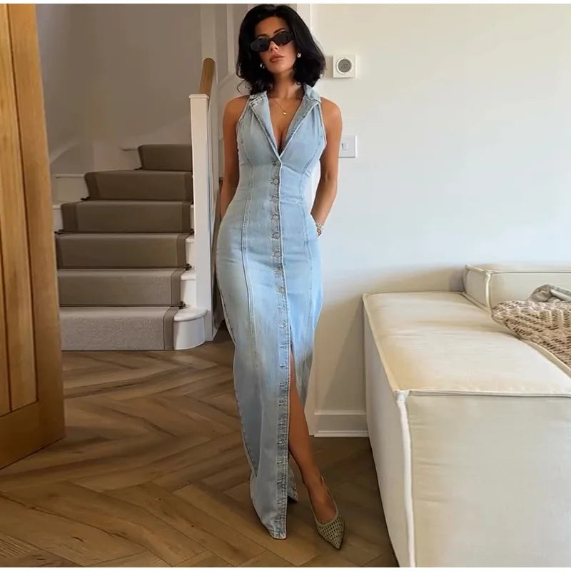 Close-up of the V-neck and button detail on a sleeveless denim maxi dress.