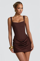 Woman wearing a brown dress - corset, ruched, tank