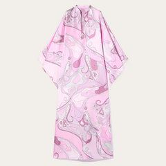 Pink and white patterned dress on a light beige background