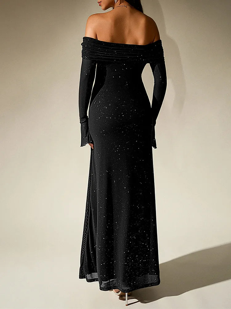 Black off-shoulder evening gown with long sleeves on a plain background