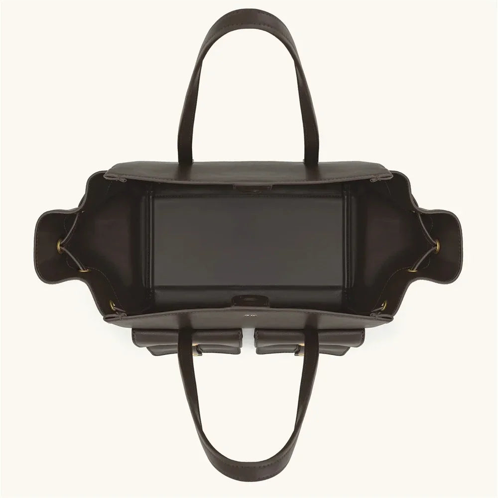 Black handbag with a unique design on a white background