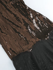 Close-up of a brown and black patterned fabric with sequins on a white background