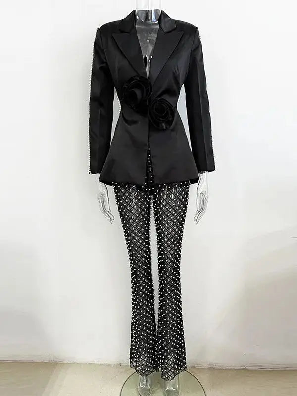 Black pearl embellished cutout blazer and beaded flare pants suit on mannequin