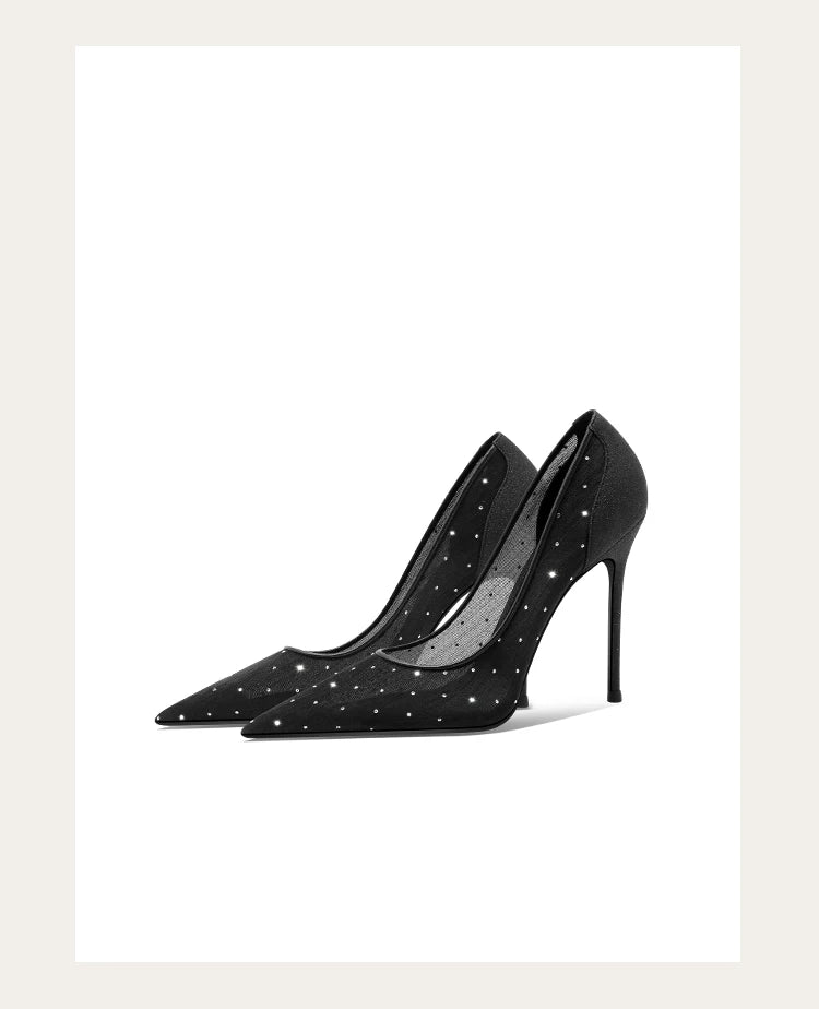 Black high-heeled shoes with star patterns on a white background