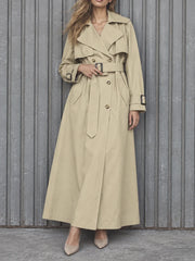 Close-up of beige belted double-breasted jacket buckle detail