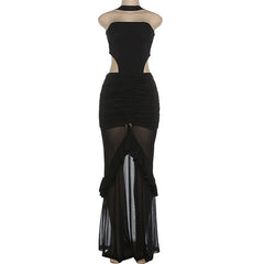 Black dress with sheer panels on a mannequin against a white background