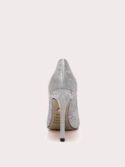 Silver high-heeled shoe on a light gray background