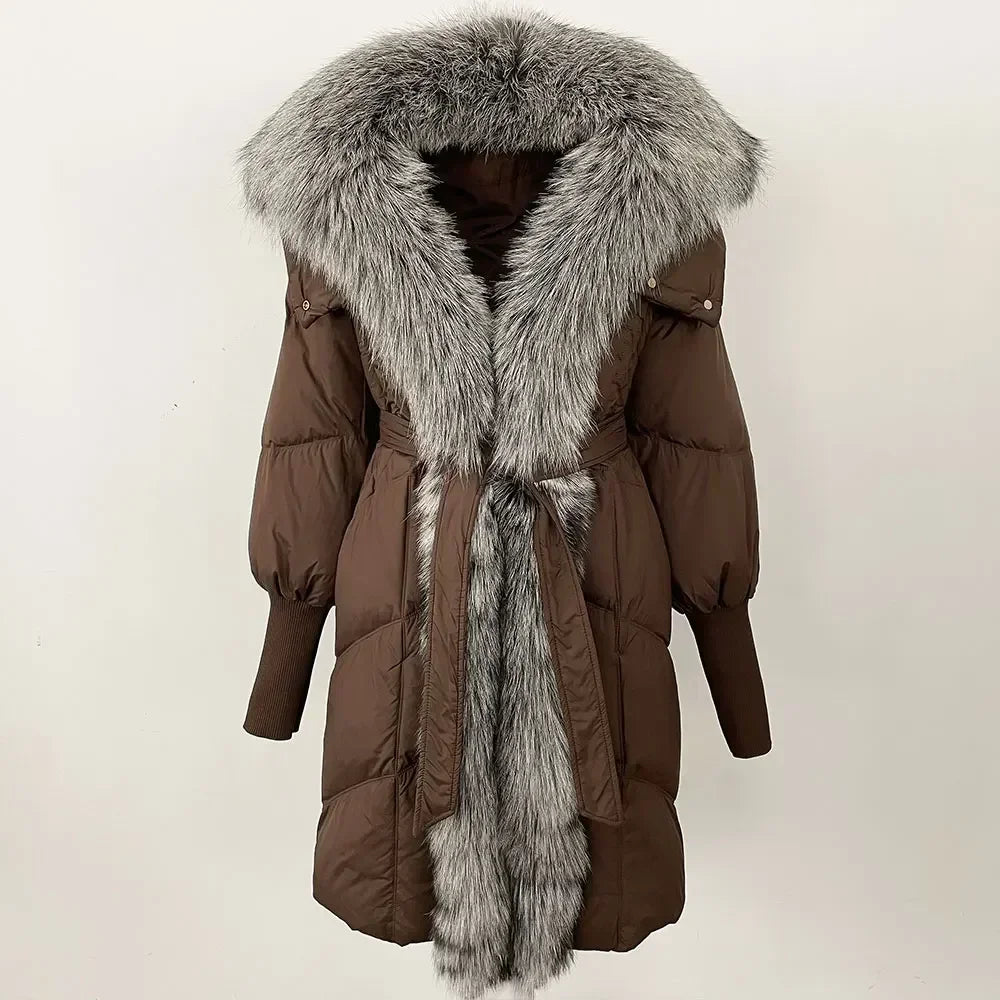 Brown winter coat with fur hood and scarf on a white background