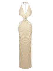 Beige evening gown with intricate detailing on a white background