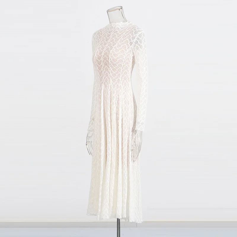 White lace dress on a mannequin against a white background