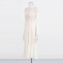 White lace dress on a mannequin against a white background
