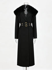 Black coat with fur collar on a mannequin against a white background