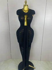 Black evening gown on a mannequin against a white background