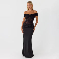 Woman wearing a black off-shoulder evening gown on a white background