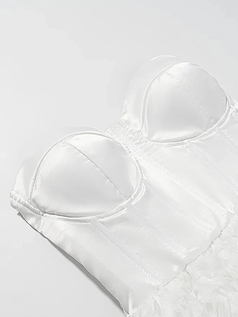 White strapless bra on a light gray background