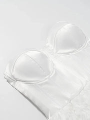 White strapless bra on a light gray background