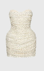 Strapless dress with a subtle pattern on a light gray background