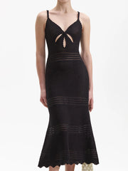 Black knit midi dress with a V-neck cutout and fishtail hem