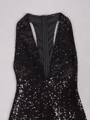 Black sequin dress on a light gray background